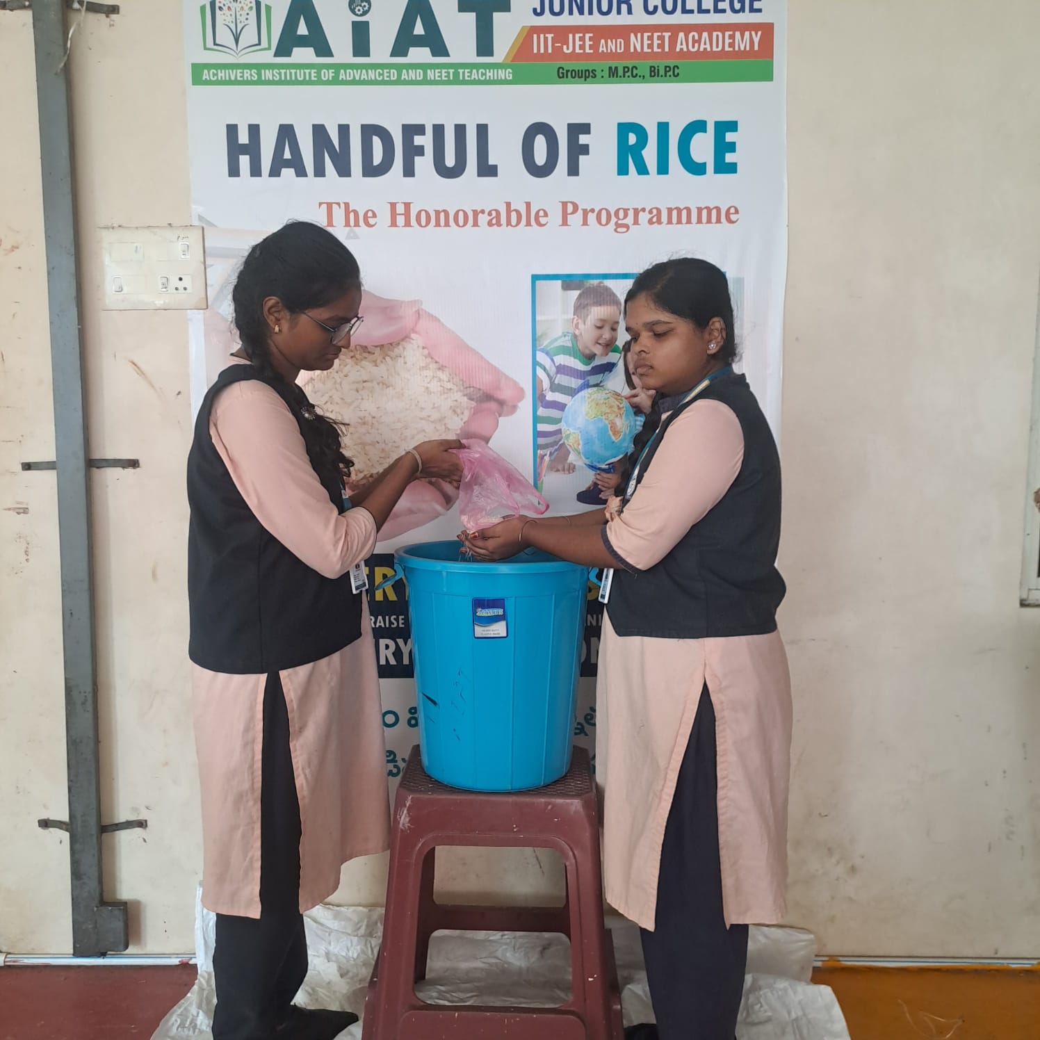 Students collecting rice for the Handful of Rice community programme